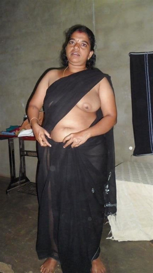 Full body mature indian business man showing something